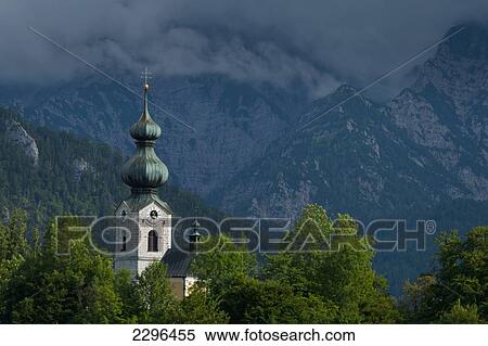 Stock Photography - Germany, Stormy clouds behind Ruhpolding church; Bavaria. Fotosearch