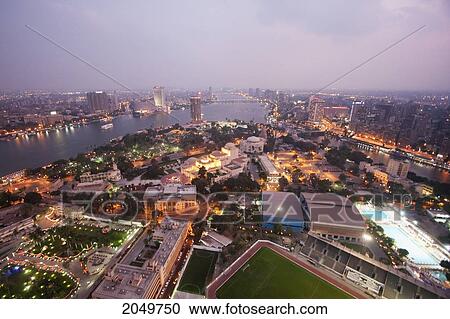 Stock Image - Gezira Sporting Club, As Seen From Cairo Tower At Dusk, Cairo, Al Qahirah, Egypt. Fotosearch