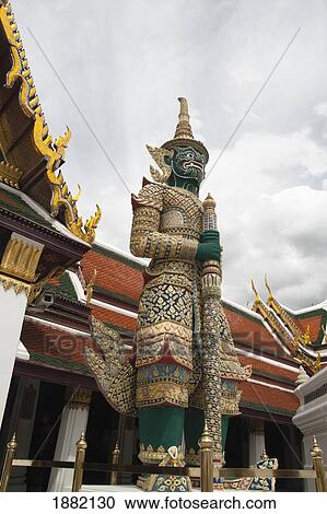 Stock Image - Giant Demons Protect The Wat Phra Kaew Temple; Bangkok, Thailand. Fotosearch