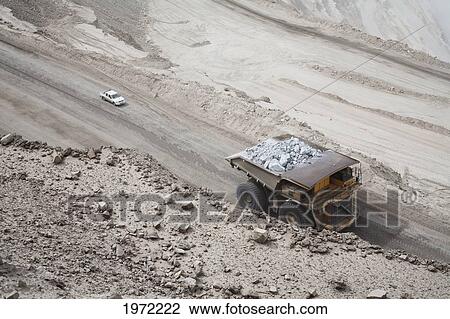 Stock Image - Giant Truck Laden With Ore At Chuquicamata, The Largest Open Pit Copper Mine In The World, Antofagasta Region, Chile. Fotosearch