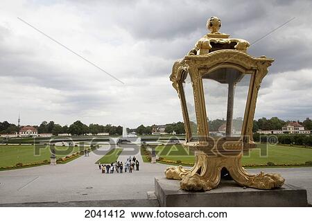 Stock Image - Gilded Lamp & Fountain In The Honor Courtyard Of The Nymphenburg Palace, Munich, Bavaria, Germany. Fotosearch