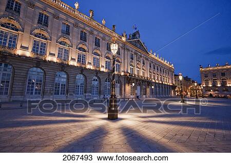 Stock Image - Gilded Wrought Iron Lantern, Created By Jean Lamou In Front Of The Hotel De Ville (City Hall) On Place Stanislas At Night, Nancy, France. Fotosearch