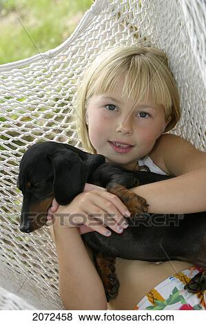 Girl And Dog In Hammock View Large Photo Image Stock Photo - Girl And Dog In Hammock. Fotosearch