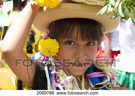 Stock Photo - Girl Carrying Festive Baskets In The Entrada De Comadritas Parade During The Carnaval Chapaco, Tarija, Bolivia. Fotosearch