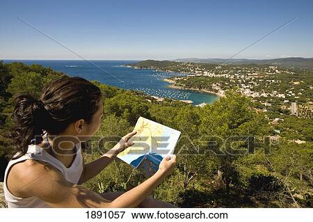Girl Checking Map, With Views Of Llafranc And Calella Beaches From San Sebastian Lighthouse View Large Photo Image Stock Photo - Girl Checking Map, With Views Of Llafranc And Calella Beaches From San Sebastian Lighthouse. Fotosearch