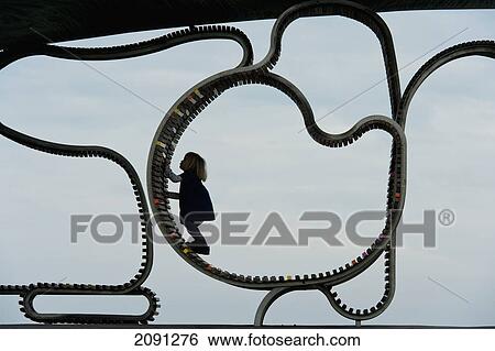Girl Climbing On 'the Longest Bench', Littlehampton, West Sussex, Uk View Large Photo Image Stock Photograph - Girl Climbing On 'the Longest Bench', Littlehampton, West Sussex, Uk. Fotosearch