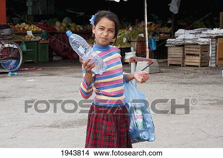 Girl Collecting Bottles, Tirana, Albania View Large Photo Image Picture - Girl Collecting Bottles, Tirana, Albania. Fotosearch