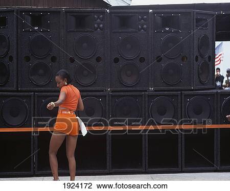Stock Image - Girl Dancing In Front Of Bank. Fotosearch