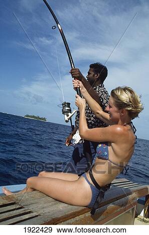 Stock Photo - Girl Deep-Sea Fishing ÃƒÆ’Ã‚Â¡. Fotosearch