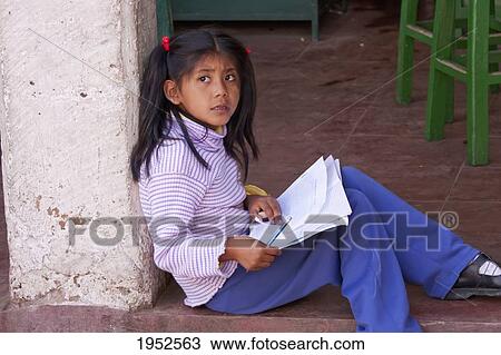 Stock Image - Girl doing homework, Sucre, Chuquisaca Department, Bolivia. Fotosearch