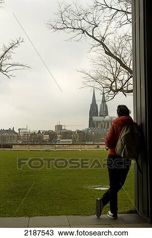 Stock Image - Girl Enjoying The View Of Cologne Cathedral, Cologne, Germany. Fotosearch