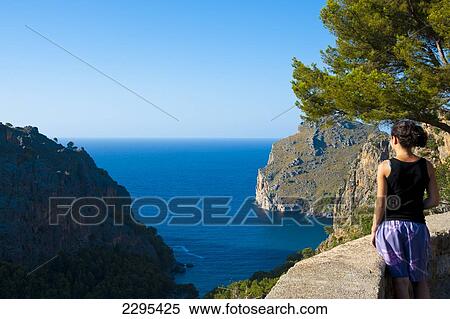 Stock Photography - Girl Enjoying The View Of The Sea From Serra De Tramuntana, Mallorca, Balearic Islands, Spain. Fotosearch