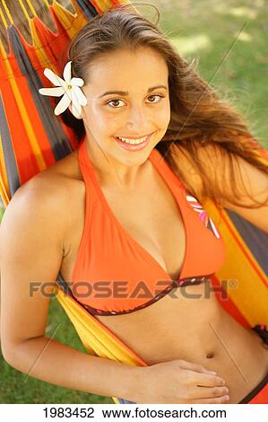 Stock Image - Girl Hanging In A Hammock.. Fotosearch