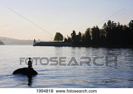 Stock Photo - Girl In A Wetsuit Statue In Stanley Park, Vancouver, British Columbia, Canada. Fotosearch