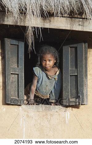 Girl In A Window Of A House Along The Road Between Ambositra & Ambavalao, Fianarantsoa Province, Madagascar View Large Photo Image Stock Image - Girl In A Window Of A House Along The Road Between Ambositra & Ambavalao, Fianarantsoa Province, Madagascar. Fotosearch