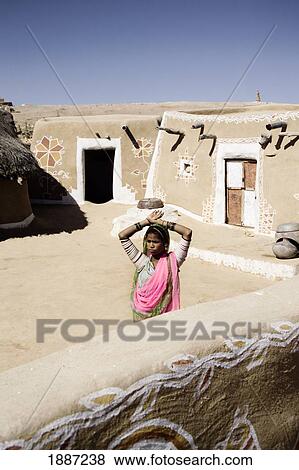 Girl In Colorful Sari Standing In Mud Village Courtyard View Large Photo Image Stock Photo - Girl In Colorful Sari Standing In Mud Village Courtyard. Fotosearch