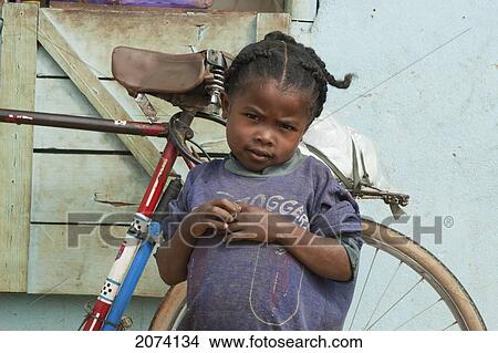 Girl In Front Of A Bar In Ambalavao, Fianarantsoa Province, Madagascar View Large Photo Image Picture - Girl In Front Of A Bar In Ambalavao, Fianarantsoa Province, Madagascar. Fotosearch