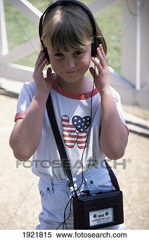 Girl Listening To Headset With Stars And Stripes T-Shirt, Graceland View Large Photo Image Stock Photography - Girl Listening To Headset With Stars And Stripes T-Shirt, Graceland. Fotosearch