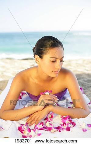 Girl On Beach With Orchids. View Large Photo Image Stock Image - Girl On Beach With Orchids.. Fotosearch