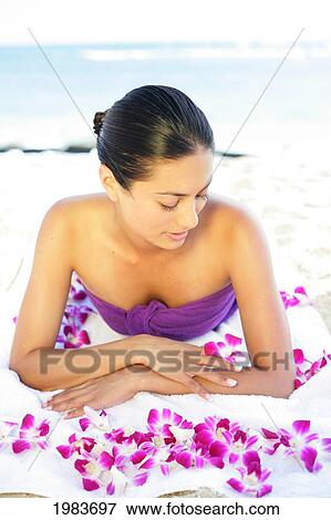 Girl On Beach With Orchids. View Large Photo Image Stock Photo - Girl On Beach With Orchids.. Fotosearch