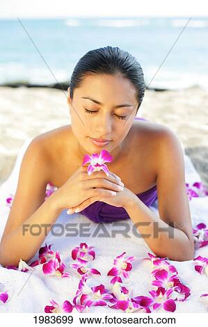 Girl On Beach With Orchids. View Large Photo Image Stock Photo - Girl On Beach With Orchids.. Fotosearch