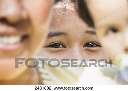 Stock Image - Girl on board the car ferry between Parapat and Samosir Island, Lake Toba, North Sumatra, Indonesia. Fotosearch