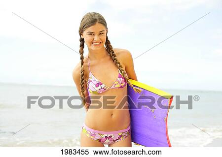 Girl On The Beach With Boogieboard. View Large Photo Image Stock Photography - Girl On The Beach With Boogieboard.. Fotosearch