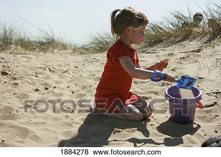 Girl Playing With Bucket And Spade On Dune View Large Photo Image Stock Photo - Girl Playing With Bucket And Spade On Dune. Fotosearch