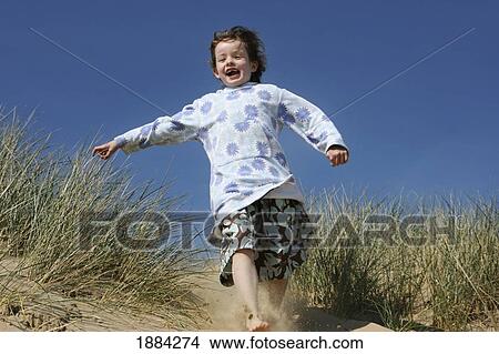 Girl Running Down Sand Dune View Large Photo Image Picture - Girl Running Down Sand Dune. Fotosearch
