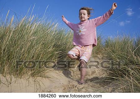 Girl Running Down Sand Dune View Large Photo Image Stock Image - Girl Running Down Sand Dune. Fotosearch