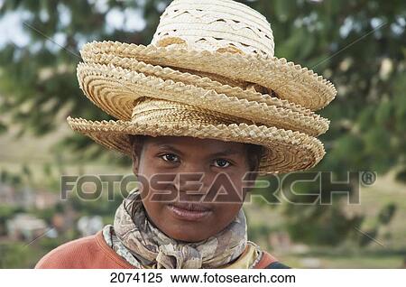 Stock Photography - Girl Selling Hats In Tritiva, Antananarivo Province, Madagascar. Fotosearch
