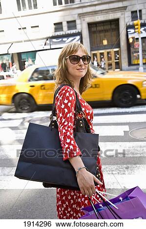 Stock Photograph - Girl Shopping On Fifth Avenue. Fotosearch