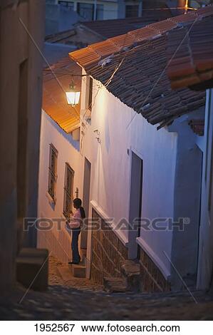 Girl standing at doorsteps, Sucre, Chuquisaca Department, Bolivia View Large Photo Image Stock Photo - Girl standing at doorsteps, Sucre, Chuquisaca Department, Bolivia. Fotosearch