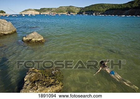 Picture - Girl Swimming In Sea At Cala Mongo. Fotosearch