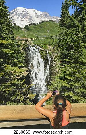 Girl Taking Photo On Smart Phone Paradise Trail Near Mount Rainier Lodge Mount Rainier National Park; Washington United States Of America View Large Photo Image Stock Image - Girl Taking Photo On Smart Phone Paradise Trail Near Mount Rainier Lodge Mount Rainier National Park; Washington United States Of America. Fotosearch
