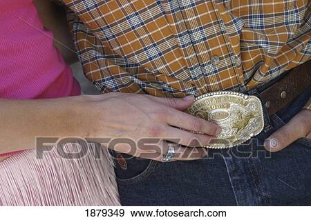 Girl Touching Mans Belt Buckle View Large Photo Image Stock Photo - Girl Touching Mans Belt Buckle. Fotosearch
