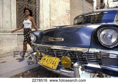 Stock Photograph - Girl walking by American 50. Fotosearch