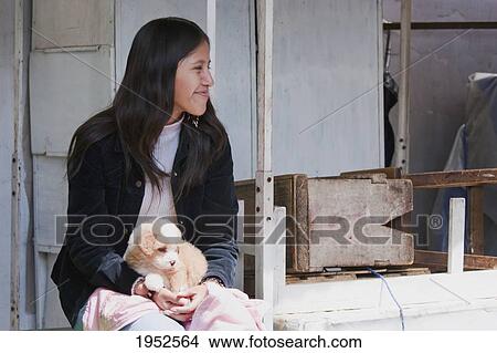 Picture - Girl with a puppy, Sucre, Chuquisaca Department, Bolivia. Fotosearch