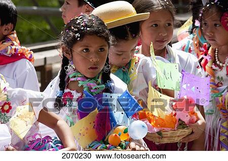 Stock Image - Girls Carrying Festive Baskets In The Entrada De Comadritas Parade During The Carnaval Chapaco, Tarija, Bolivia. Fotosearch