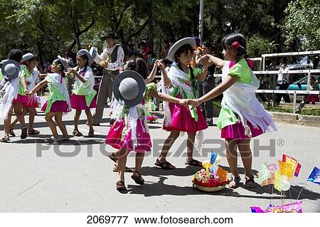 Girls Dancing Around A Festive Basket In The Entrada De Comadritas Parade During The Carnaval Chapaco, Tarija, Bolivia View Large Photo Image Stock Photo - Girls Dancing Around A Festive Basket In The Entrada De Comadritas Parade During The Carnaval Chapaco, Tarija, Bolivia. Fotosearch