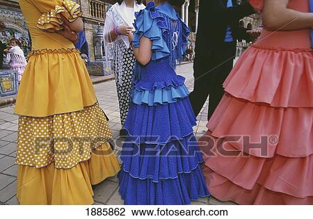 Stock Image - Girls In Traditional Dress During Feria. Fotosearch