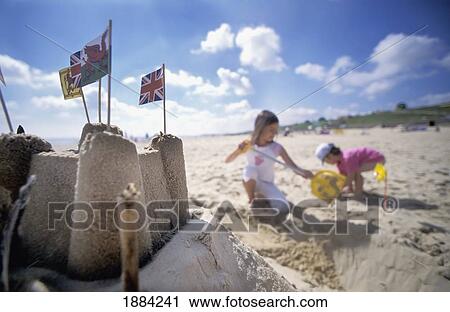 Girls On The Beach Making A Sandcastle View Large Photo Image Stock Image - Girls On The Beach Making A Sandcastle. Fotosearch