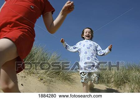 Girls Running Down Sand Dune View Large Photo Image Stock Image - Girls Running Down Sand Dune. Fotosearch