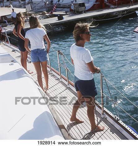 Girls Standing On The Deck Of A Yacht View Large Photo Image Picture - Girls Standing On The Deck Of A Yacht. Fotosearch