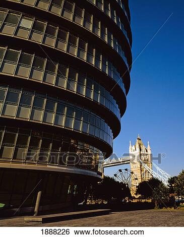 Stock Photograph - Gla Building With Tower Bridge Behind. Fotosearch