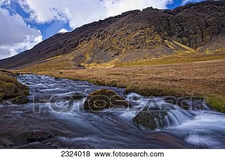 Stock Photo - Glacial stream along the southern coastline of the Snaefellsnes peninsula; Iceland. Fotosearch