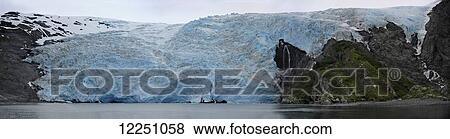 Glacier and shoreline of a lake; Alaska, United States of America View Large Photo Image Stock Photo - Glacier and shoreline of a lake; Alaska, United States of America. Fotosearch