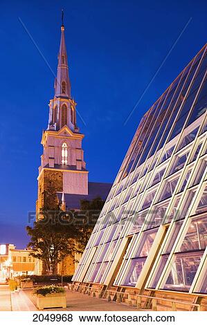 Stock Photo - Glass Building And Saint-Germain Cathedral At Dusk, Bas-Saint-Laurent Region, Rimouski, Quebec. Fotosearch