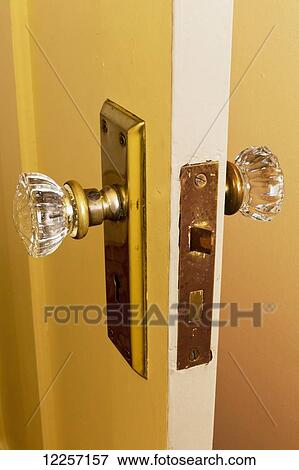 Glass doorknobs on a door in a heritage house; Vancouver, British Columbia, Canada View Large Photo Image Stock Photo - Glass doorknobs on a door in a heritage house; Vancouver, British Columbia, Canada. Fotosearch