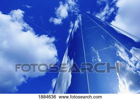 Glass Obelisk With Blue Sky And Cloud Reflections View Large Photo Image Stock Photograph - Glass Obelisk With Blue Sky And Cloud Reflections. Fotosearch